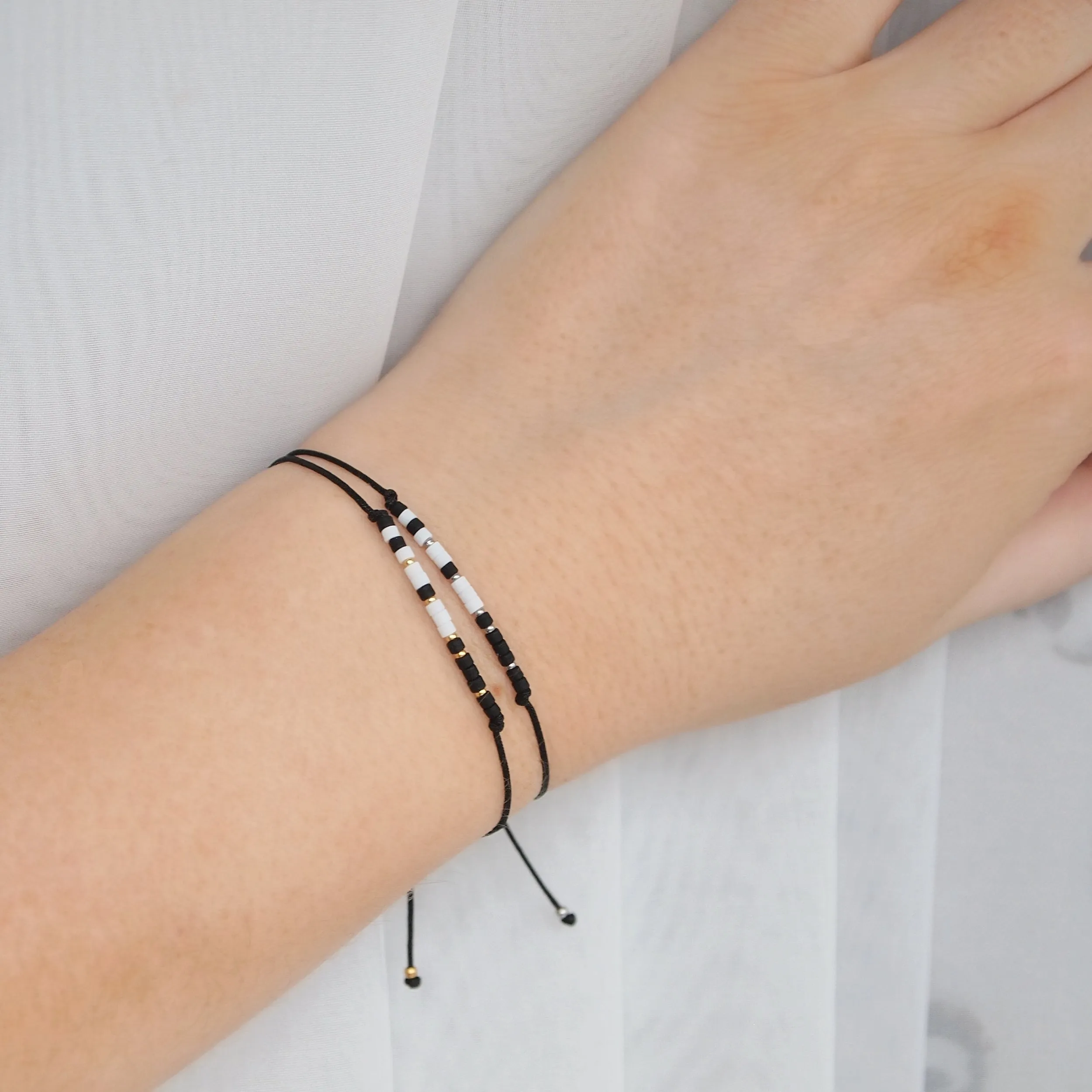 Custom morse code bracelets in black and white